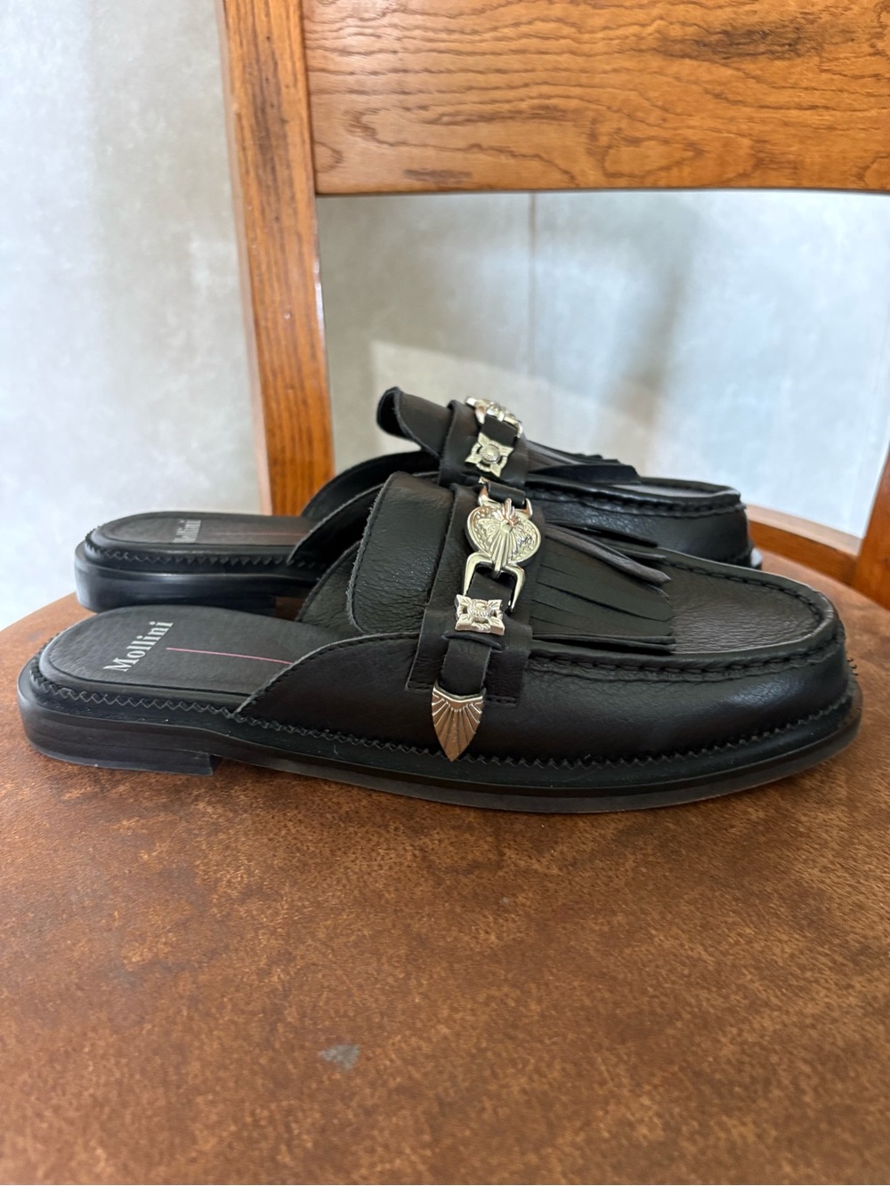 Mollini Women’s Black Slip-On Kiltie Loafers with Silver Hardware